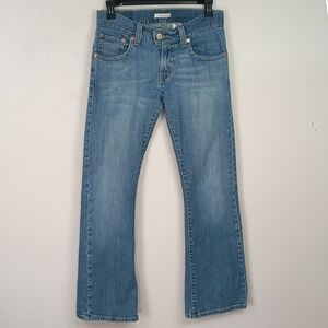 Levi's women's 542 mid Rise boot cut Tilted flare Blue jeans sz 10M